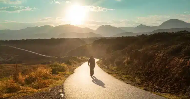 Image of a Christian man walking down a path on a journey