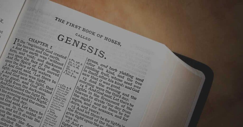 Image of the Bible opened with a chapter from Romans displayed