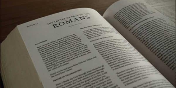Picture of the Bible opened to the book of Romans
