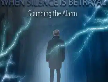 A man standing with his back to us in silence