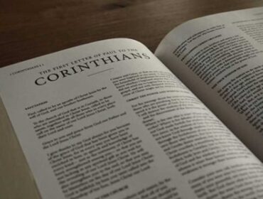 Image of the Bible opened to the book of 1 Corinthians