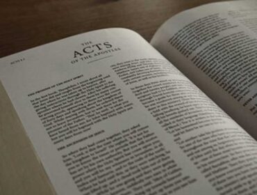 Image of the Bible opened to the book of Acts