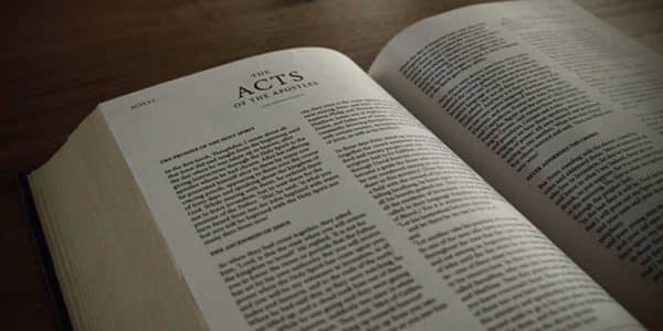 Image of the Bible opened to the book of Acts