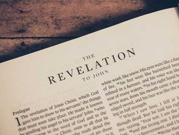 Image showing the book Revelation open to a chapter