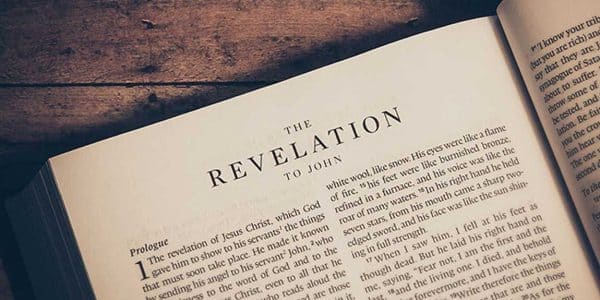 Image showing the book Revelation open to a chapter
