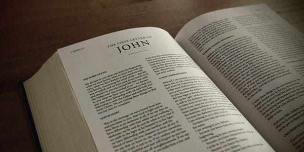Bible opened to the book of 1 John