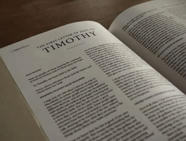 Image of the Bible opened to the book 1 Timothy