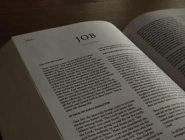 Bible opened to the Old Testament book of Job