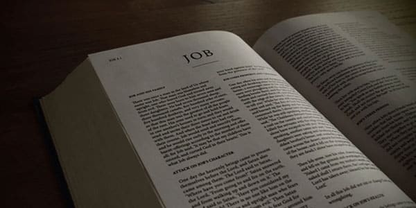 Bible opened to the Old Testament book of Job