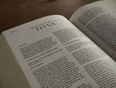 Bible opened to the book Titus