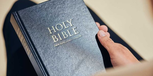 Hands holding a Bible